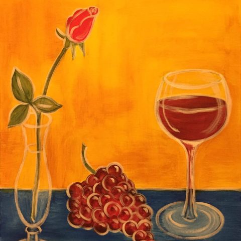 a glass of wine on a table