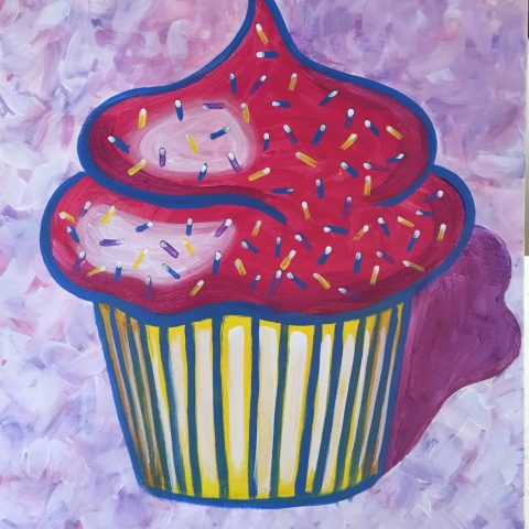 a bed with a pink blanket