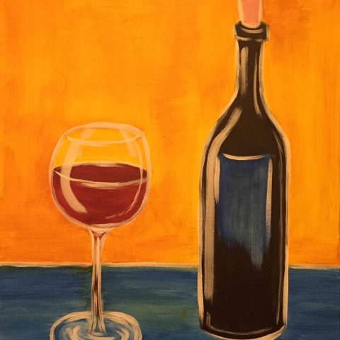 a close up of a bottle and a glass of wine