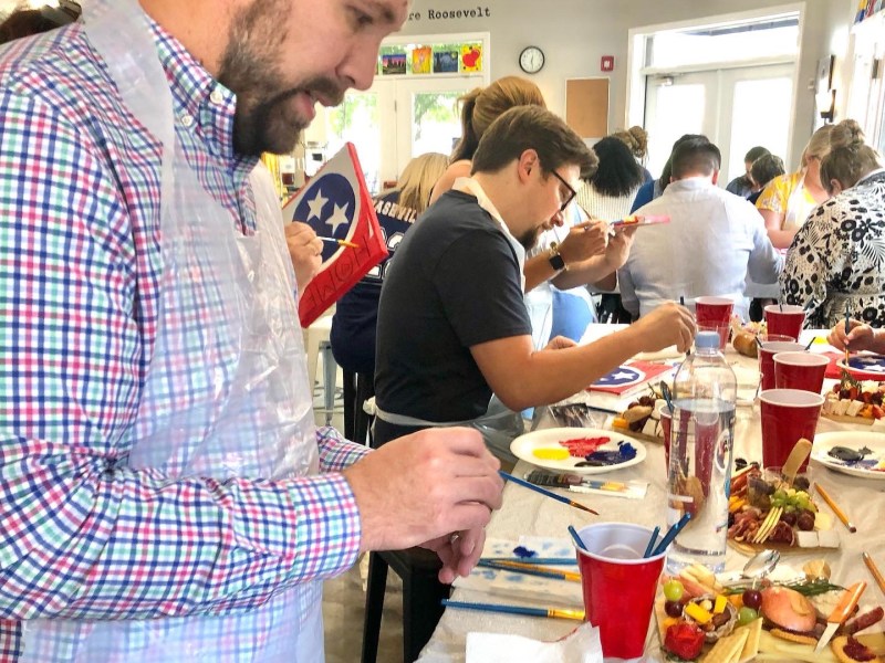 a group of people sitting at a table