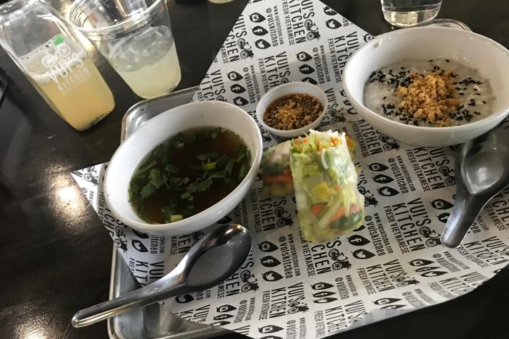 a plate of food and a cup of coffee on a table