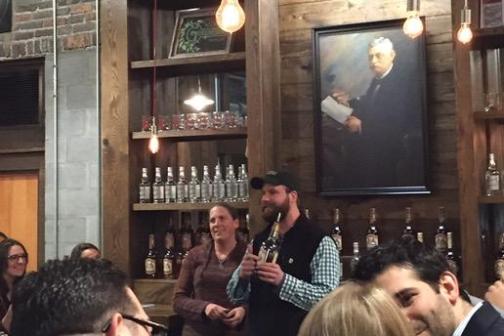 a group of people sitting at a bar
