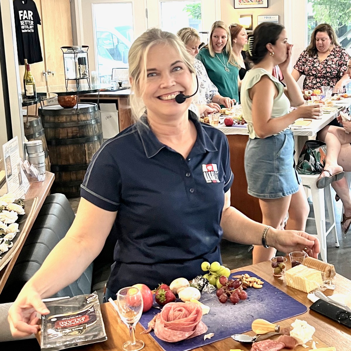 a group of people standing on top of a cutting board with a cake