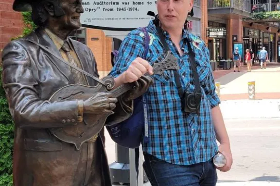 a man and a woman standing in front of a building