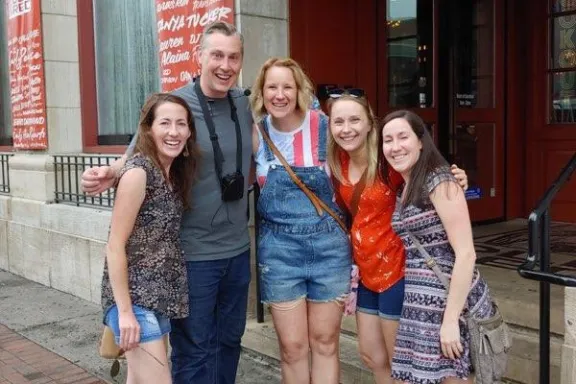 a group of people standing in front of a building