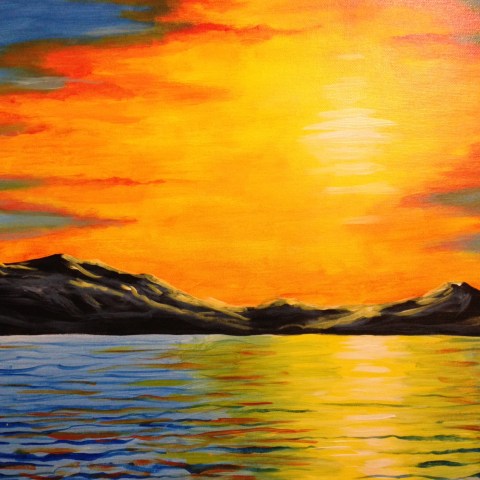 a sunset over a body of water