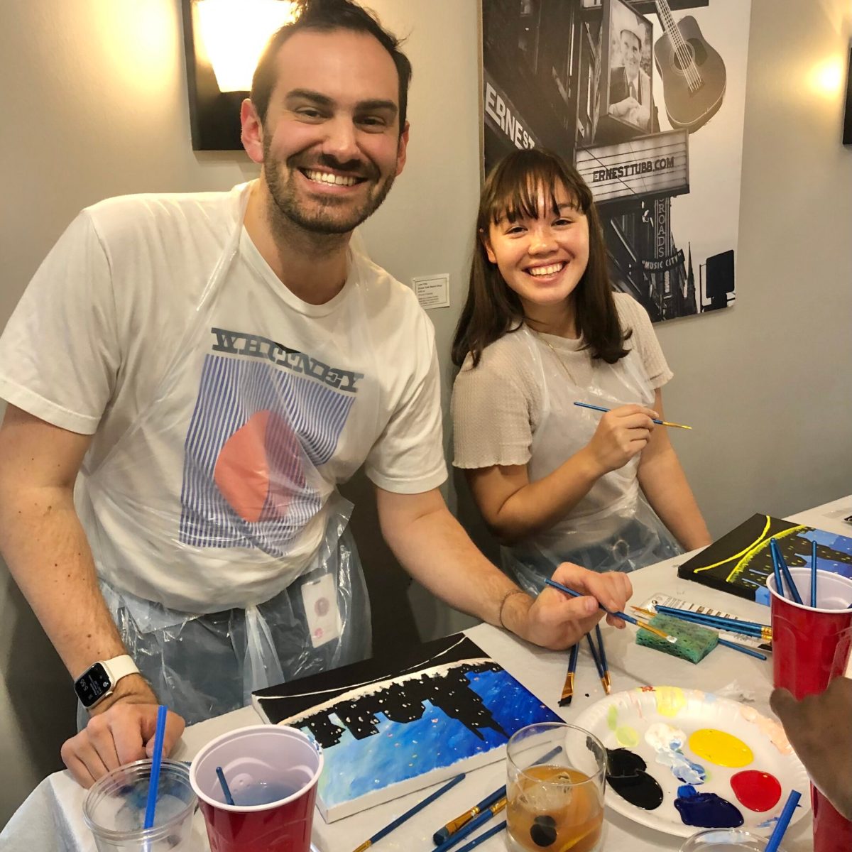 a couple of people painting