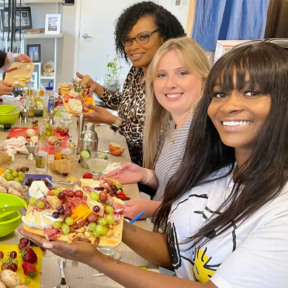 a woman sitting at a table with food